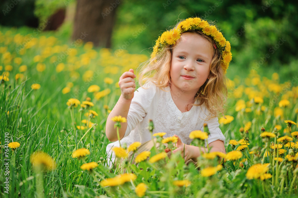 adorable child girl in wreath portrait on spring dandelion field adorable child girl in wreath portrait on spring dandelion field