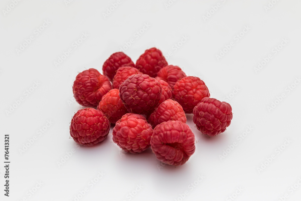 Composition of fresh ripe raspberries isolated on white backgrou Composition of fresh ripe raspberries isolated on white backgrou