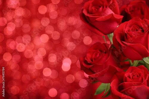 Red roses on bokeh background