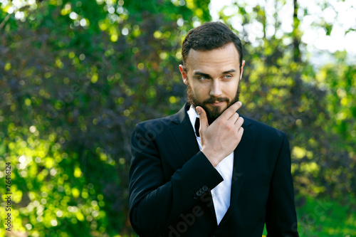 bridegroom in park in spring