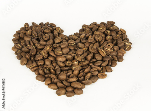 Heart, lined with coffee beans. White background. Isolated.