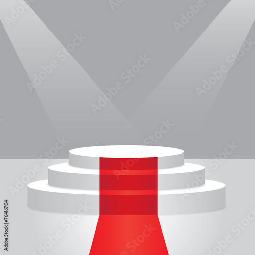 Empty illuminated podium with red carpet