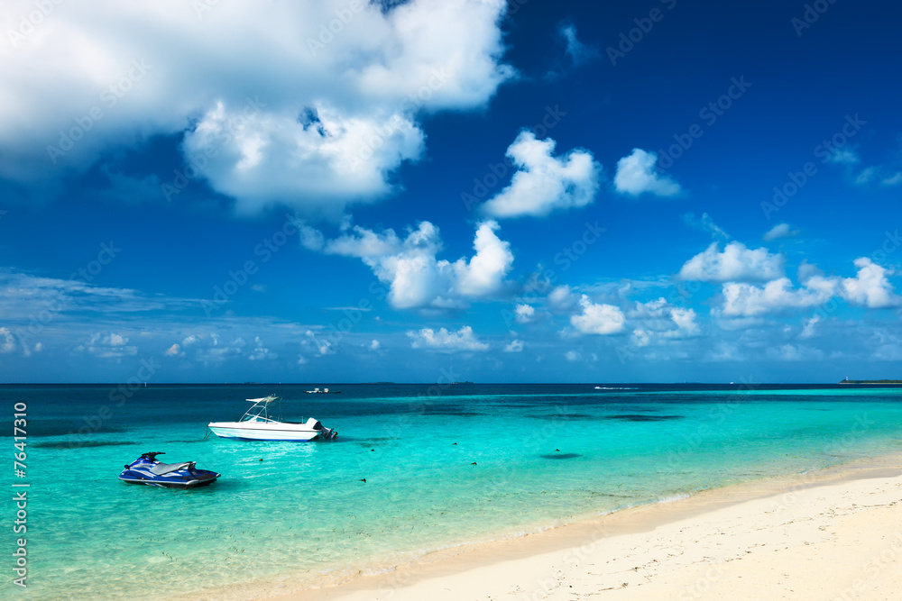 Beautiful island beach with motor boat Beautiful island beach with motor boat