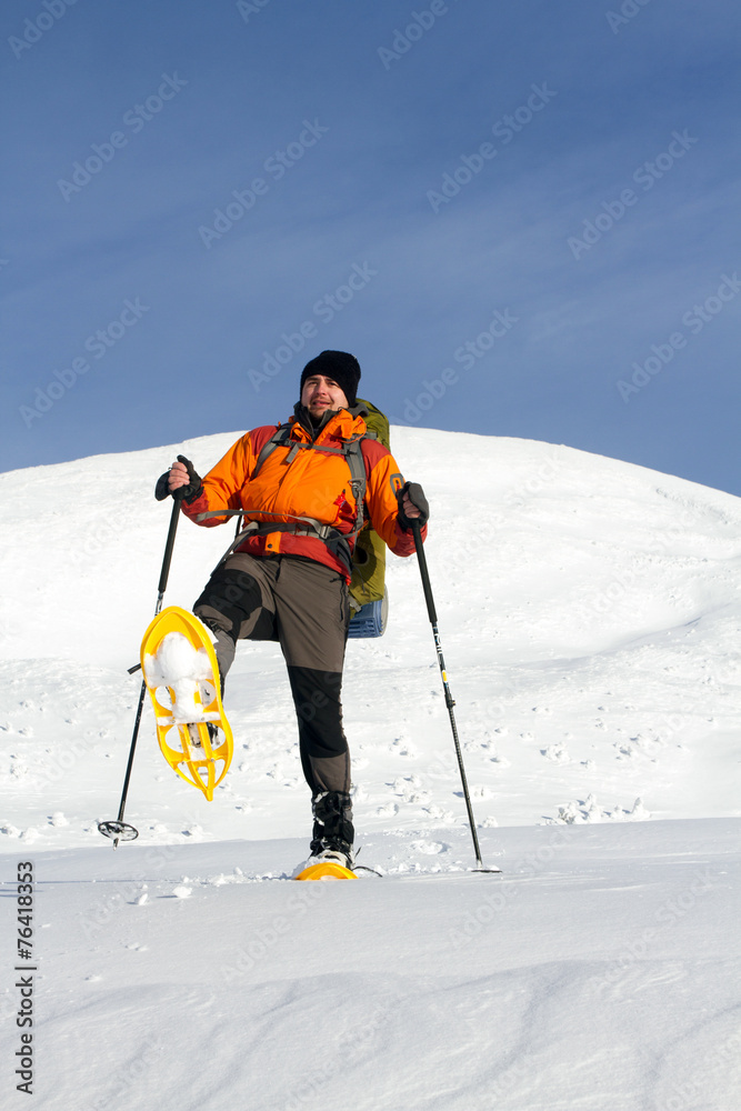 Hiker in winter mountains