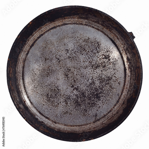 Dirty old frying pan on a white