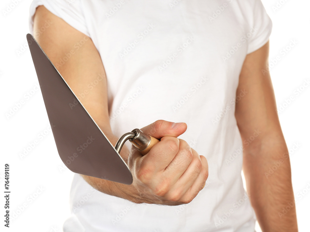 Building trowel in male hand isolated on white