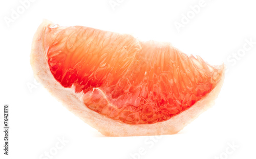 Delicious slice of grapefruit isolated on white