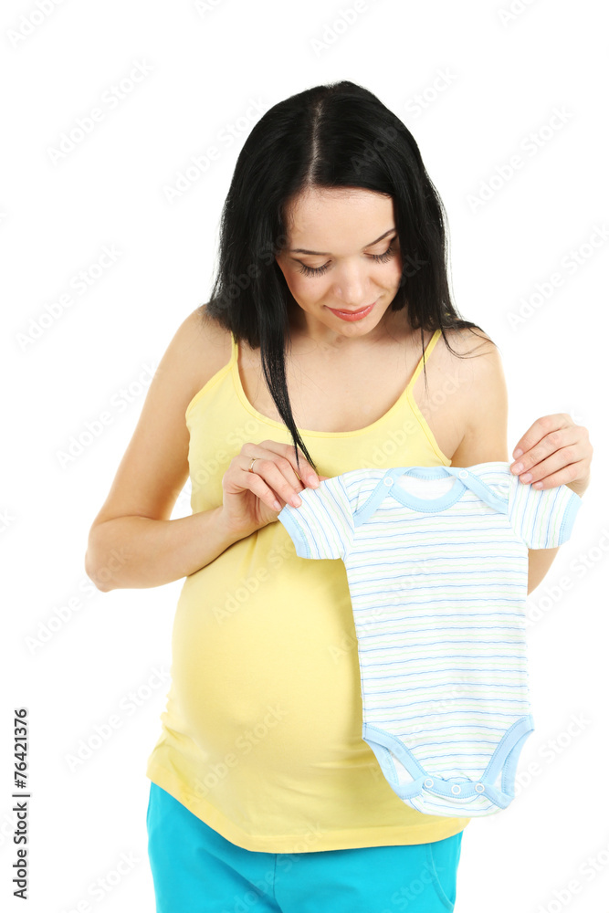 Beautiful young pregnant woman with baby clothes isolated Beautiful young pregnant woman with baby clothes isolated