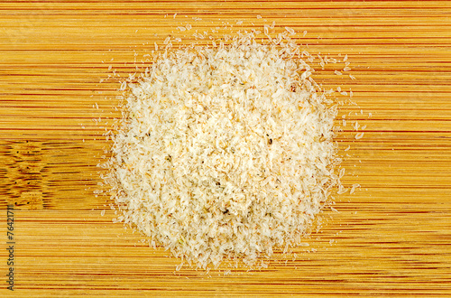 Pile of Psyllium on wooden background photo