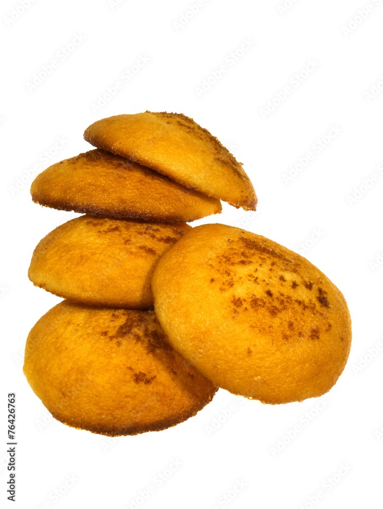 Golden yellow baked Dutch egg cakes over white Golden yellow baked Dutch egg cakes over white