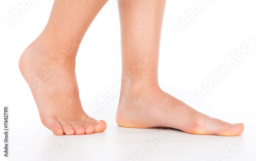 Woman foot stepping isolated