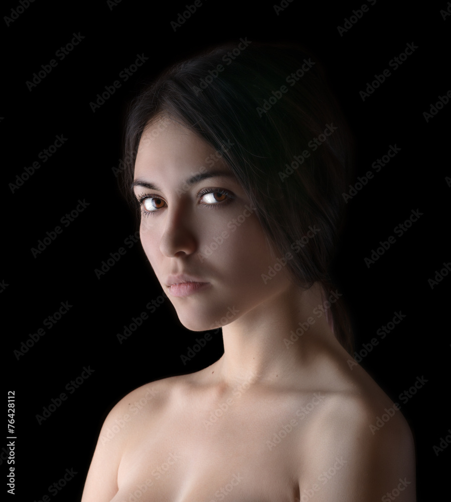 Portrait of a beautiful young brunette. Beauty on a black. Portrait of a beautiful young brunette. Beauty on a black.