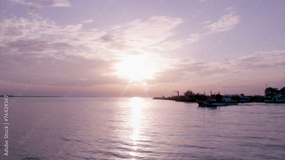 Sunset boat silhouette at Olhão fishing port. Algarve Sunset boat silhouette at Olhão fishing port. Algarve