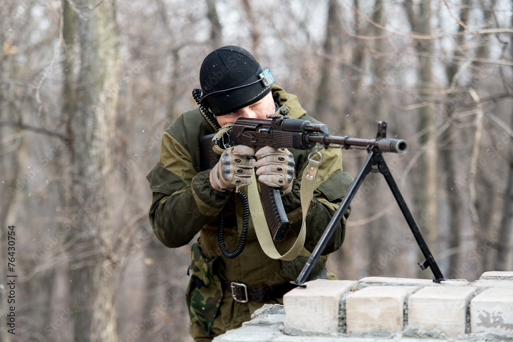 Fototapeta premium soldier in camouflage uniform