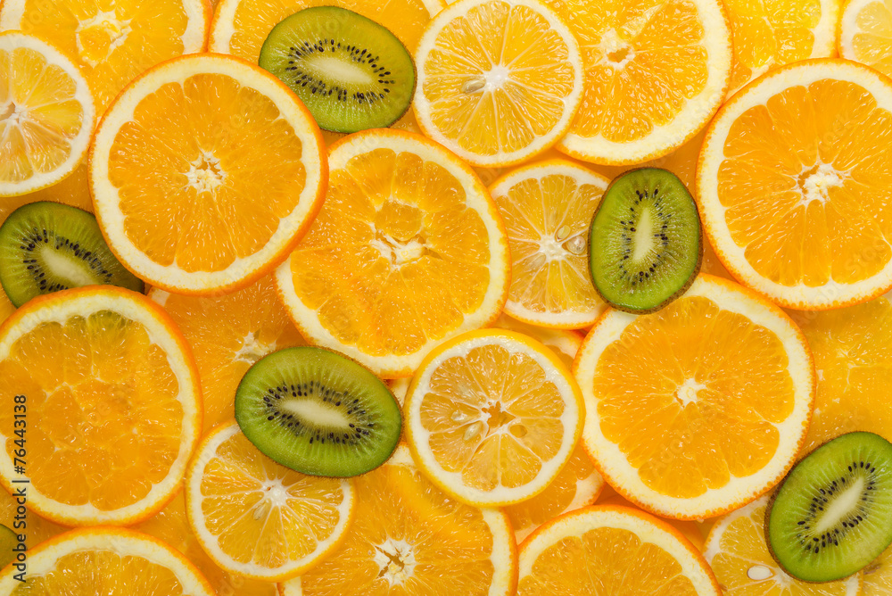 Sliced healthy fruits background Sliced healthy fruits background