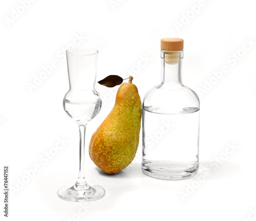 Valokuva Pear Abate Fetel with glass and alcohol bottle