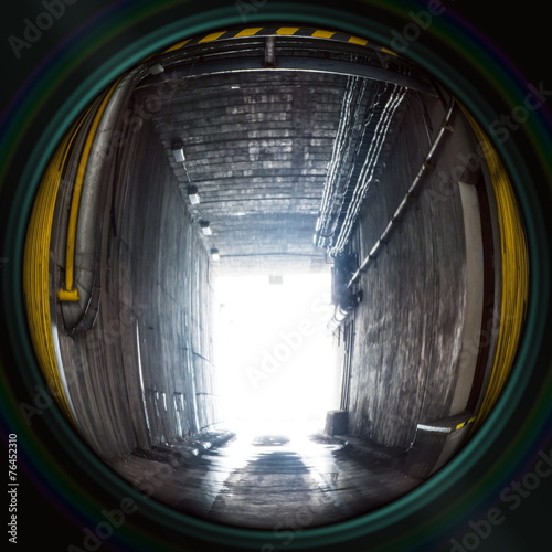 Industrial underpass with entrance gate in objective lens