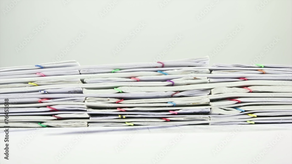 Stack paperwork report on table time lapse Stack paperwork report on table time lapse