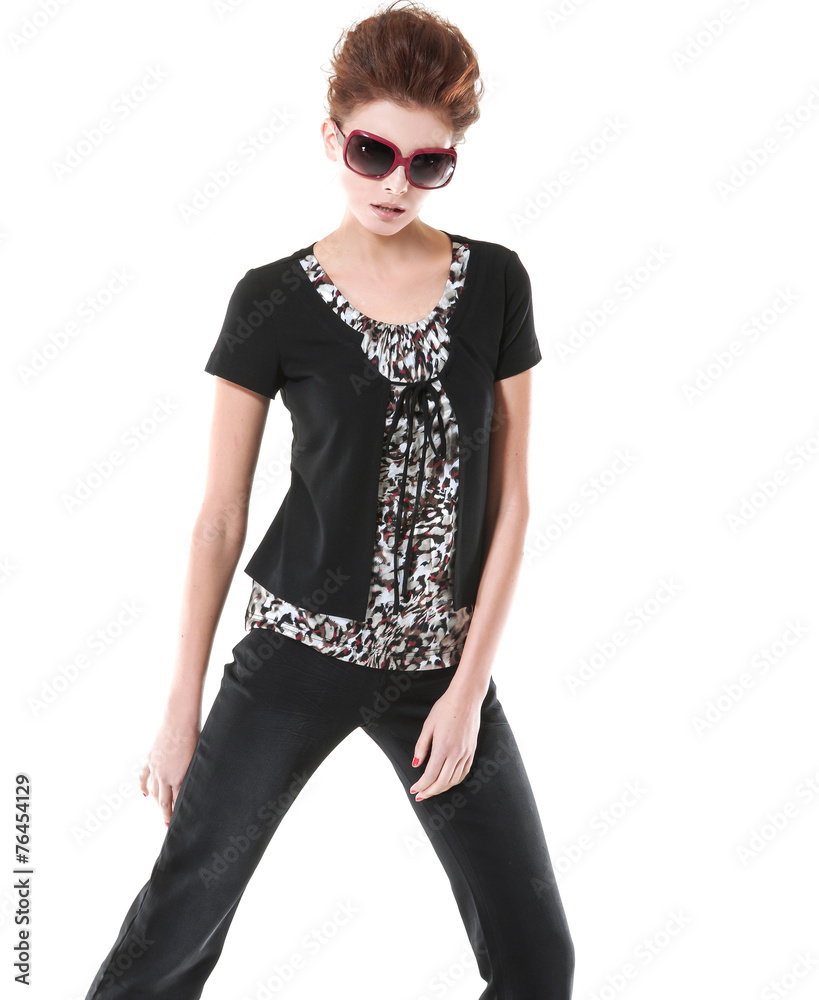 Fototapeta premium young girl wearing black dress with sunglasses posing