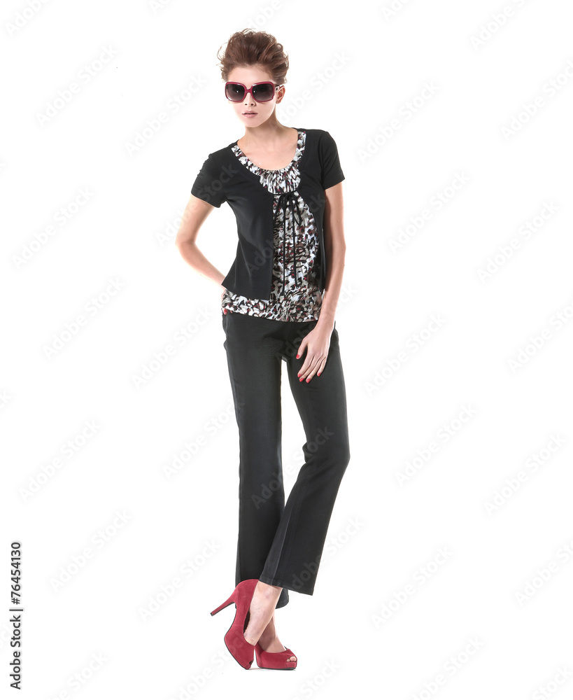 Fototapeta premium full-length young girl wearing black dress with sunglasses posing