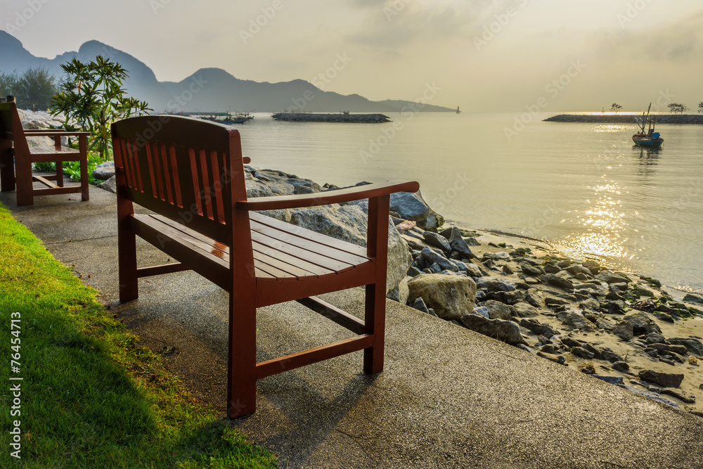 Wooden bench for relaxation at waterfront of Khlong Wan beach, T