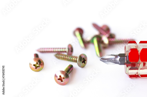 Screws and screwdriver - Stock Image