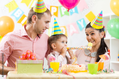 family celebrating kid's birthday