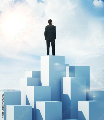 Man standing on highest cube