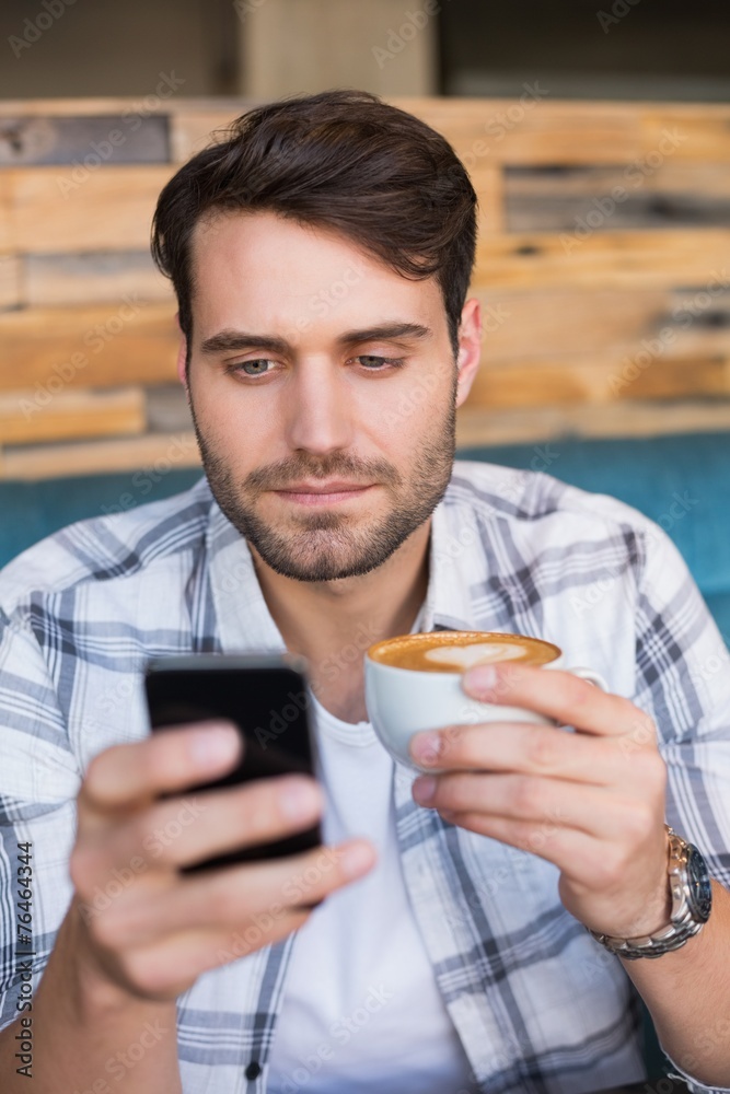 Young man having cup of coffee Young man having cup of coffee