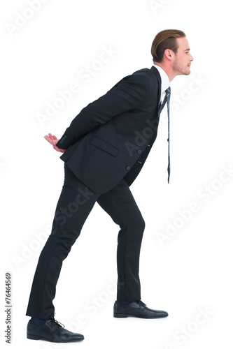 Businessman in suit leaning over