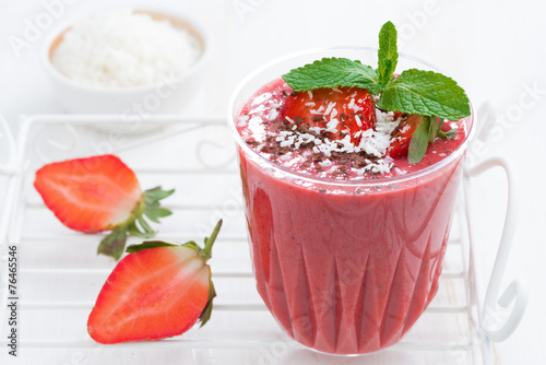 strawberry milkshake with chocolate and coconut in a glass