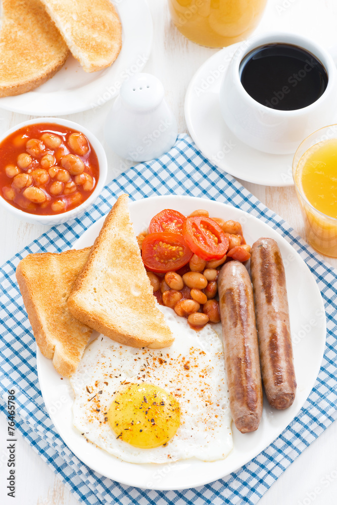 traditional English breakfast with sausages, top view