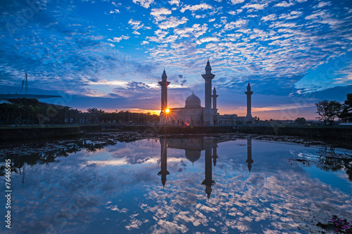 Photography Relfection of a Mosque and Clouds at sunrise