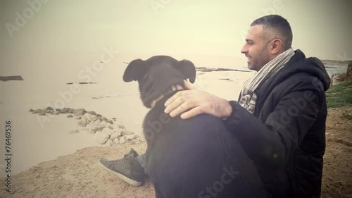 Vintage style shot of man with his dog photo