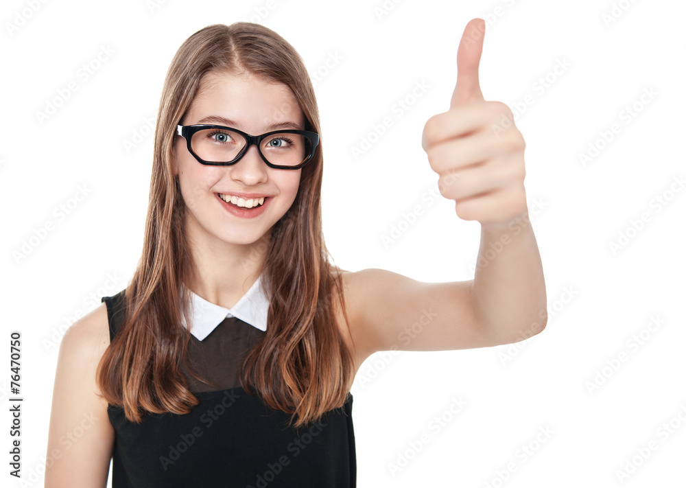 Happy young teenager girl showing thumbs up isolated Happy young teenager girl showing thumbs up isolated