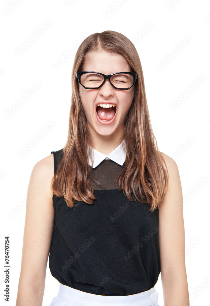 Angry young teenage girl screaming isolated