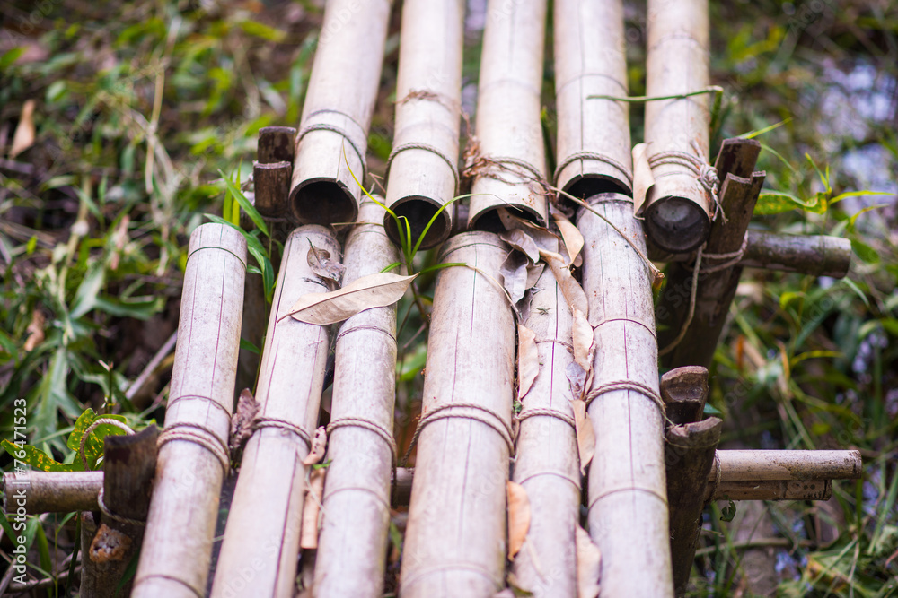 Fototapeta premium handmade bamboo bridge in garden