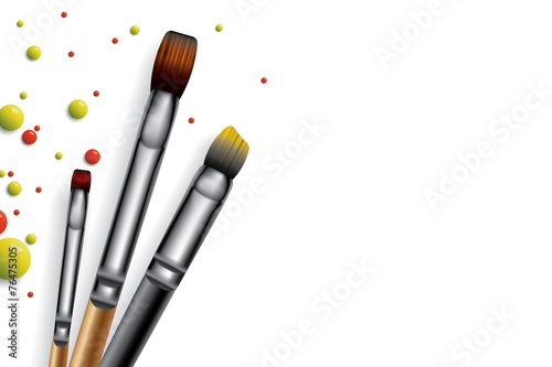 Drops of paint and brushes, place for text