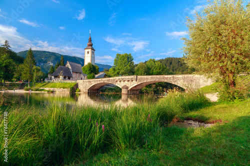 Church of Sv. John the Baptist and a bridge by the Bohinj lake photo