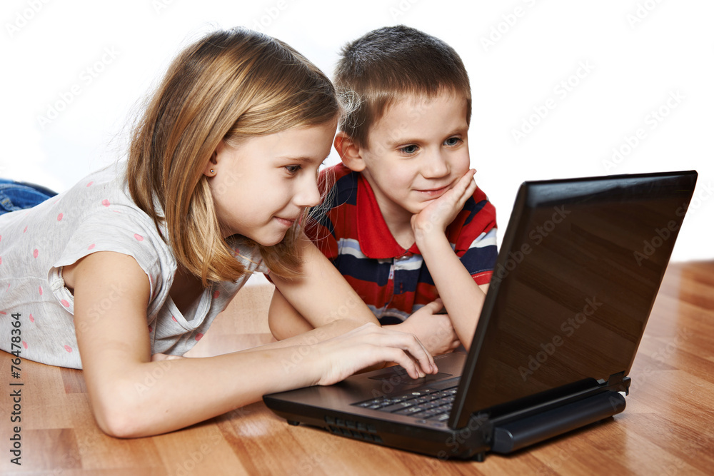 Sister and brother with laptop