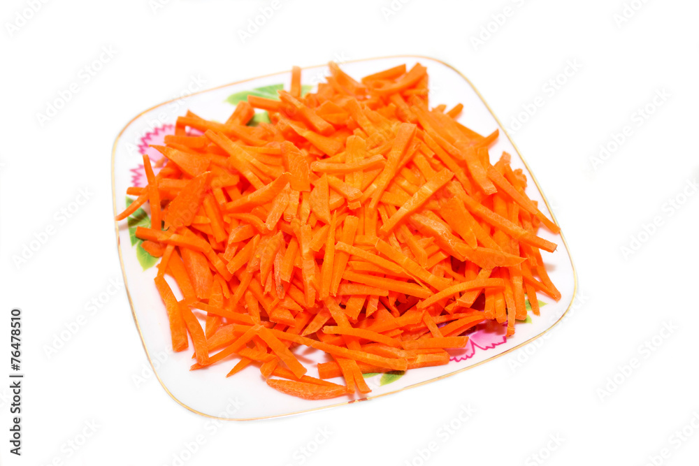 Carrot salad on a plate. Photo.