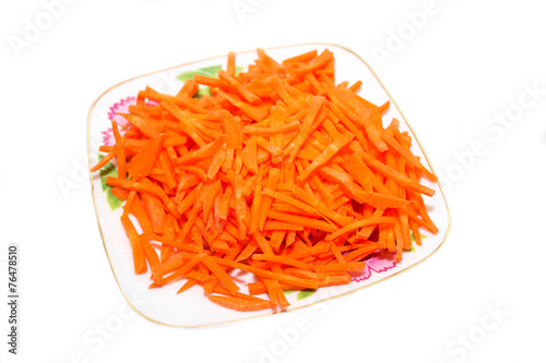 Carrot salad on a plate. Photo.