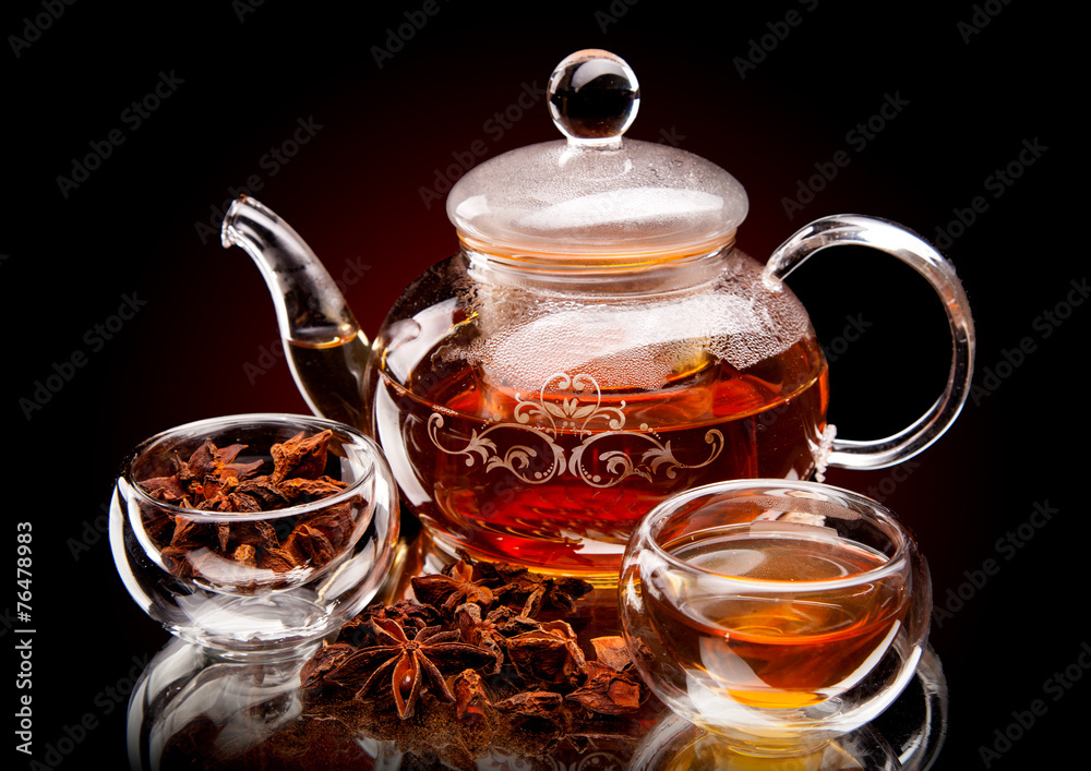 Cup of tea with teapot. With lemon and star anise Cup of tea with teapot. With lemon and star anise