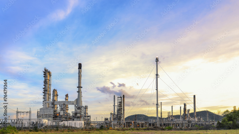 Big Industrial oil tanks in a refinery with treatment pond at in