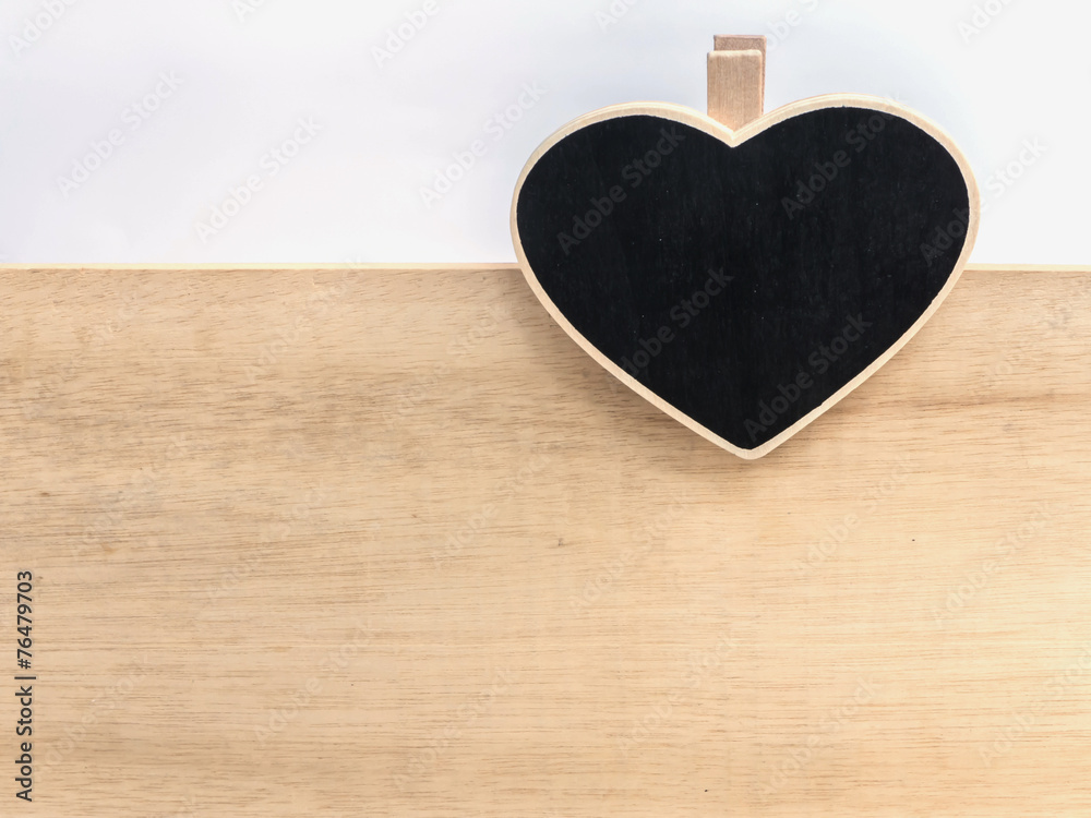 Wooden clipboard heart shape on wood board Wooden clipboard heart shape on wood board