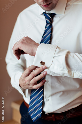 men wear a shirt and cufflinks 