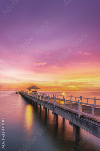 Landscape of Wooded bridge in the port between sunrise