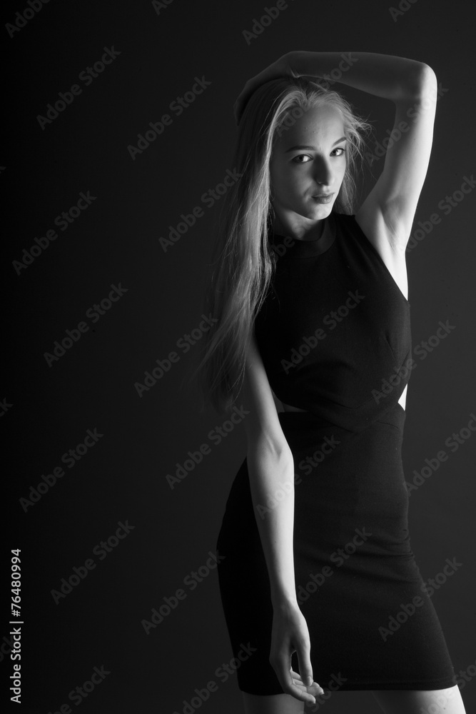 Young seductive woman posing in studio