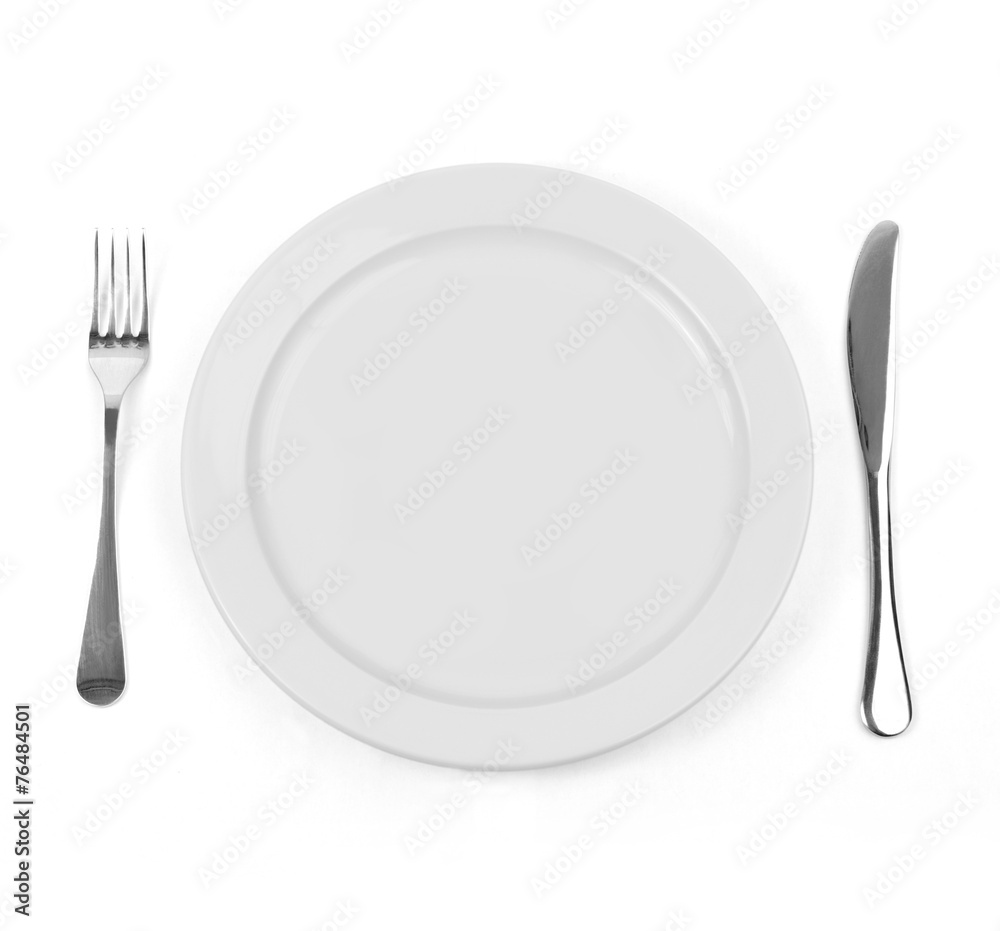 Empty dinner plate with knife and fork on white. Empty dinner plate with knife and fork on white.