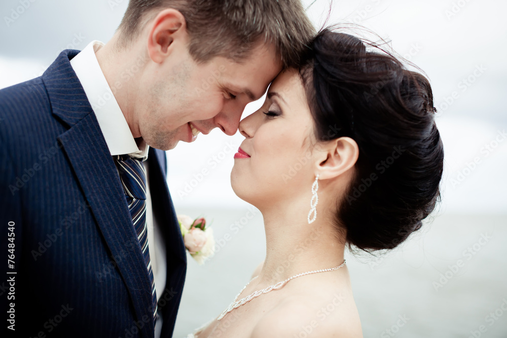 Happy bride and groom on their wedding. High key blurred image Happy bride and groom on their wedding. High key blurred image